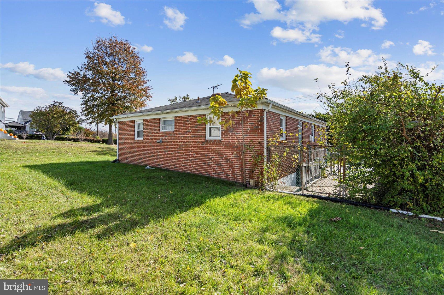 8368 Old Philadelphia Road Baltimore, MD 21237 - Photo 6 of 29 a front view of a house with garden