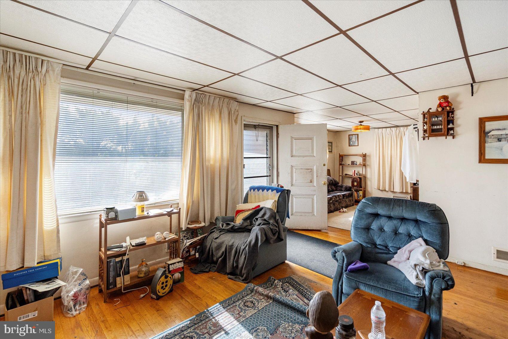 8368 Old Philadelphia Road Baltimore, MD 21237 - Photo 9 of 29 a living room with furniture and a window