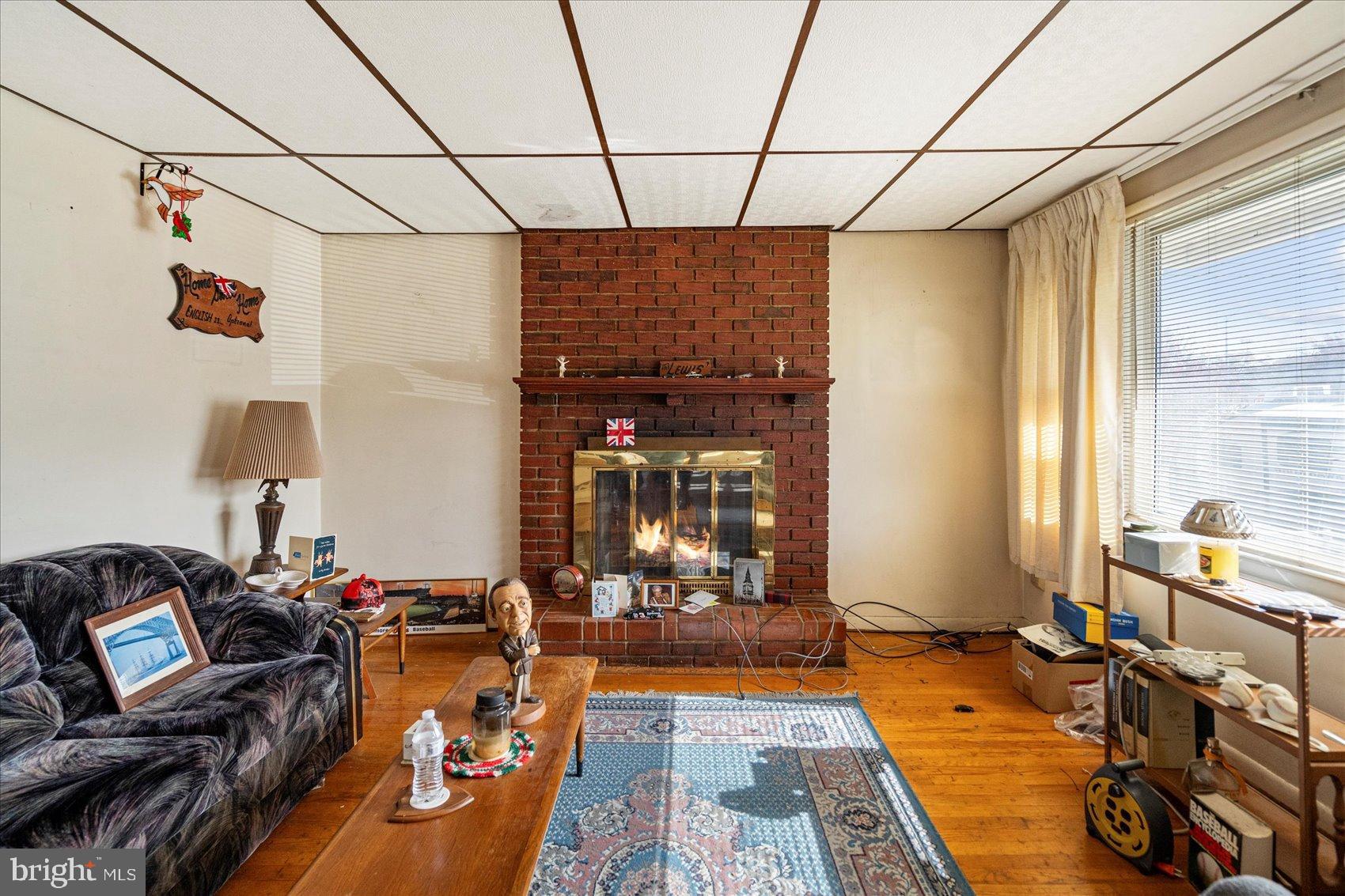 8368 Old Philadelphia Road Baltimore, MD 21237 - Photo 10 of 29 a living room with furniture a window and a table