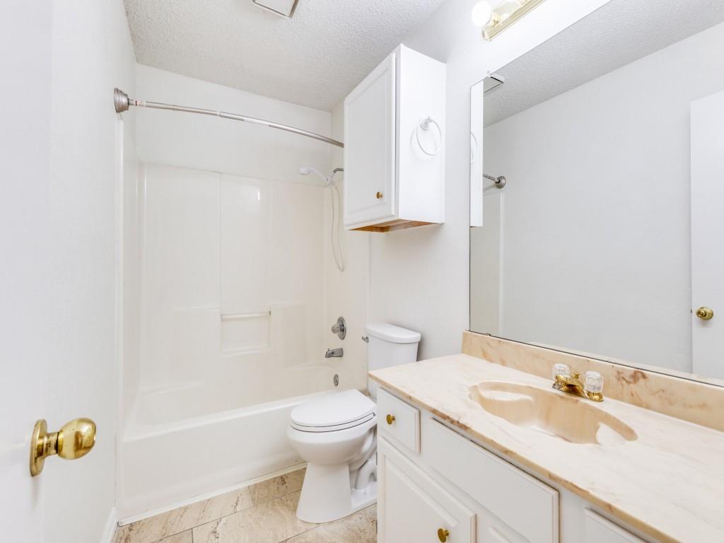 4657 Misty Ridge Drive Fort Worth, TX 76137 - Photo 19 of 25 This full bath is located on the first floor and services the guest bedrooms !