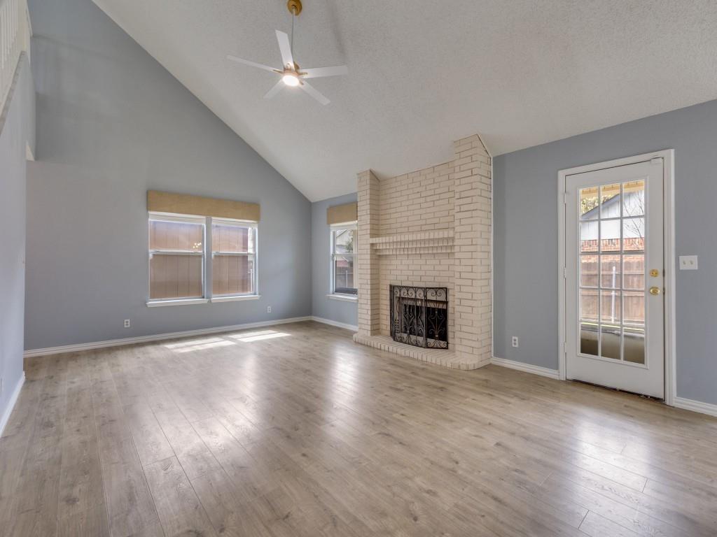 4657 Misty Ridge Drive Fort Worth, TX 76137 - Photo 6 of 25 Another view of the living room shows access to the backyard !