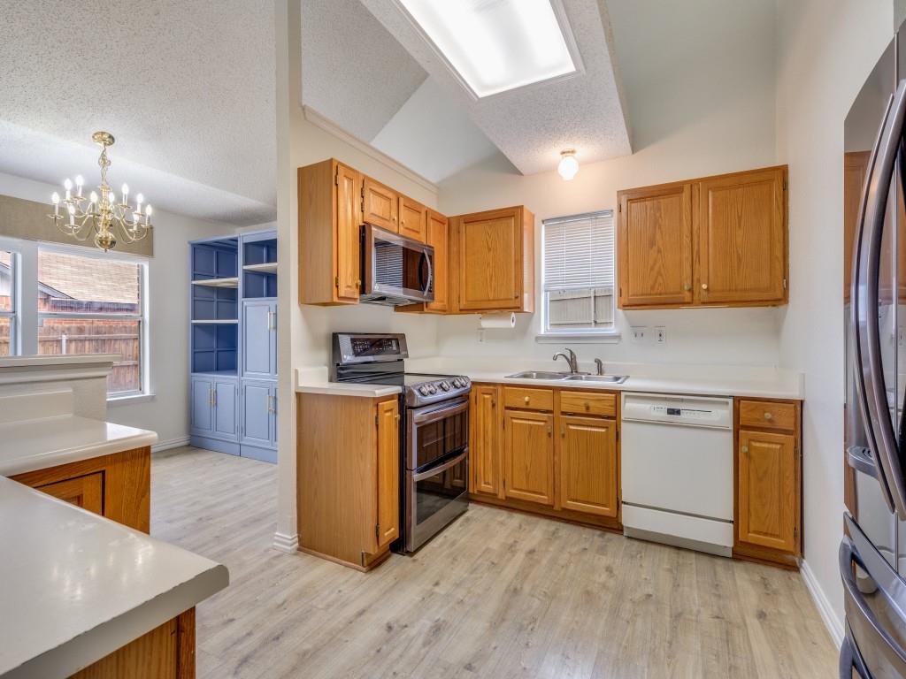 4657 Misty Ridge Drive Fort Worth, TX 76137 - Photo 9 of 25 The kitchen is equipped with stainless appliances, a double sink and plenty of counter space for food prep !