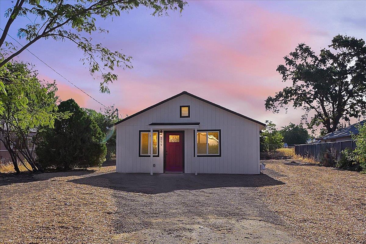 4779 Pacific Avenue Olivehurst, CA 95961 - Photo 1 of 1 a front view of a house with a yard and garage