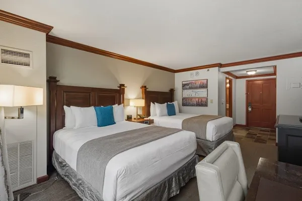 a bedroom with a bed and a night stand