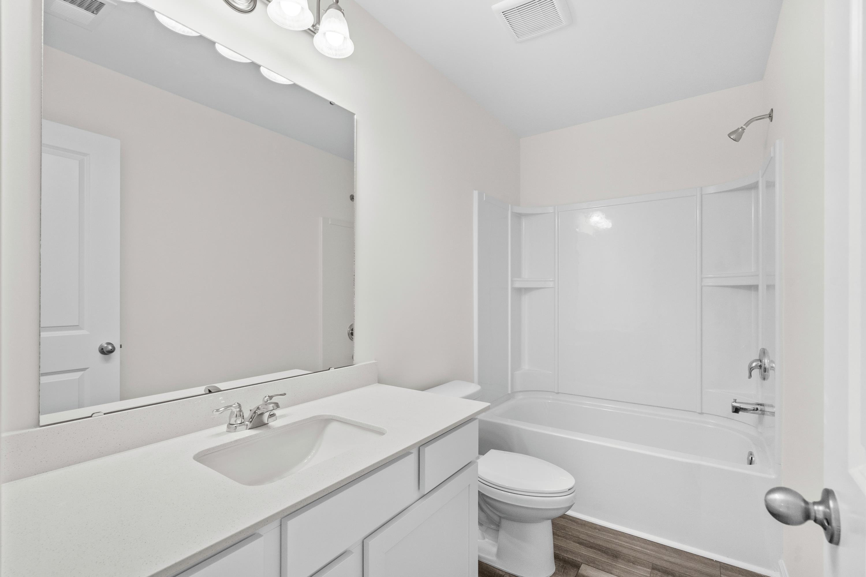 349 Sporting Drive Aynor, SC 29511 - Photo 24 of 31 Bathroom with shower / washtub combination, vanity, and dark wood-type flooring