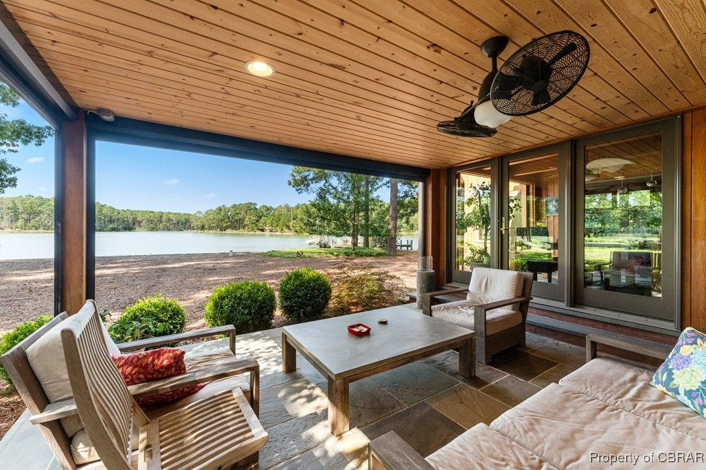 1106 Monarch Shores Road Kilmarnock, VA 22482 - Photo 13 of 44 Sunroom with wooden ceiling and a water view
