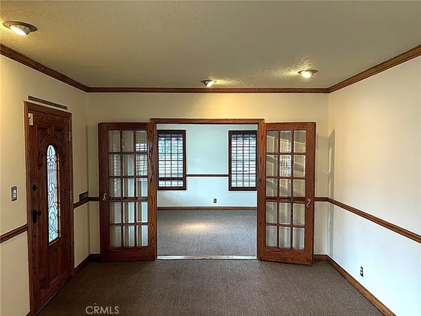 a view of empty room with windows