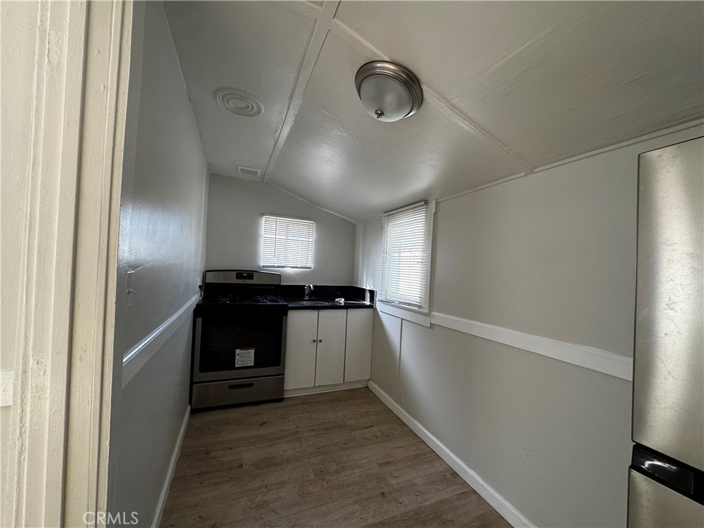 4036 4th Street Riverside, CA 92501 - Photo 3 of 10 a kitchen with a refrigerator and a stove