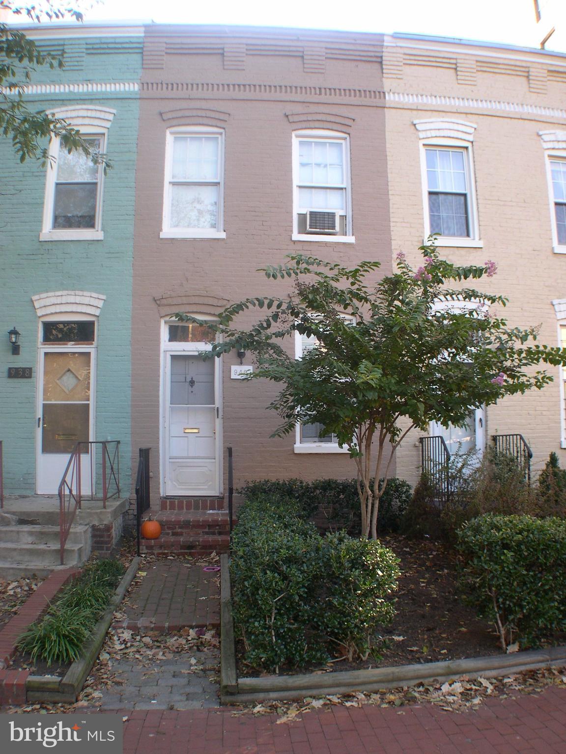 940 24th Street Northwest Washington, DC 20037 - Photo 1 of 12 a front view of a house with a yard