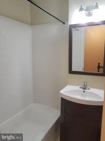 a bathroom with a sink and a bathtub