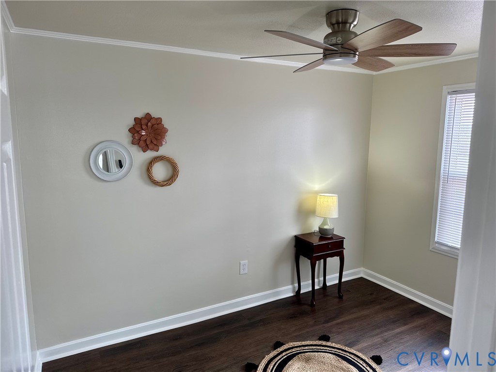 7279 Howerton Road Dunnsville, VA 22454 - Photo 13 of 17 a room with a table and a chandelier