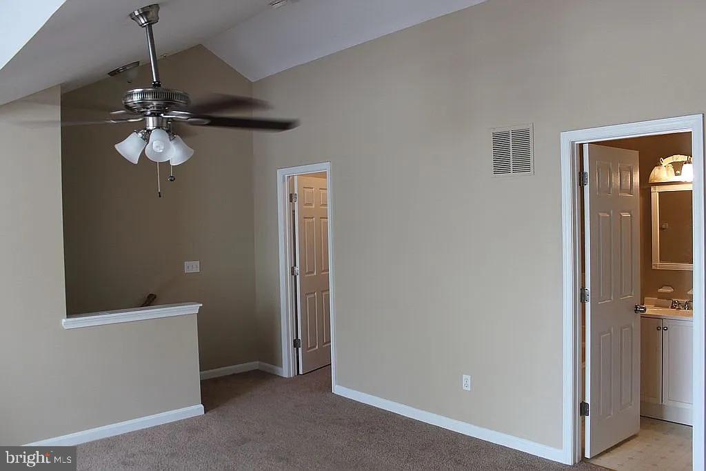 120 Langdon Farm Circle Odenton, MD 21113 - Photo 11 of 37 a view of a hallway with a chandelier fan