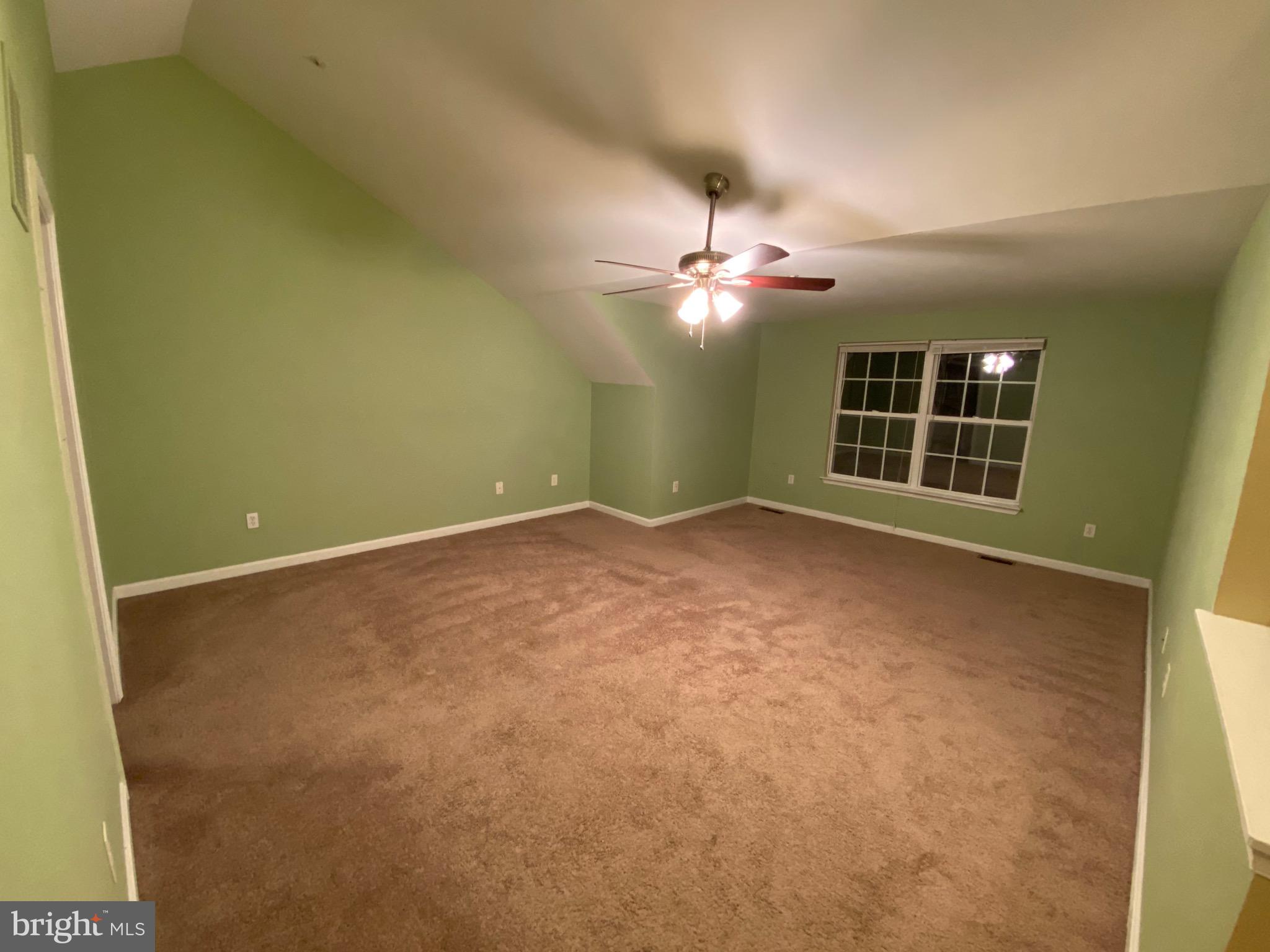 120 Langdon Farm Circle Odenton, MD 21113 - Photo 13 of 37 an empty room with windows and ceiling fan