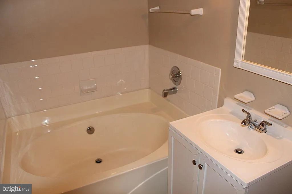 120 Langdon Farm Circle Odenton, MD 21113 - Photo 15 of 37 a bathroom with a tub and a sink