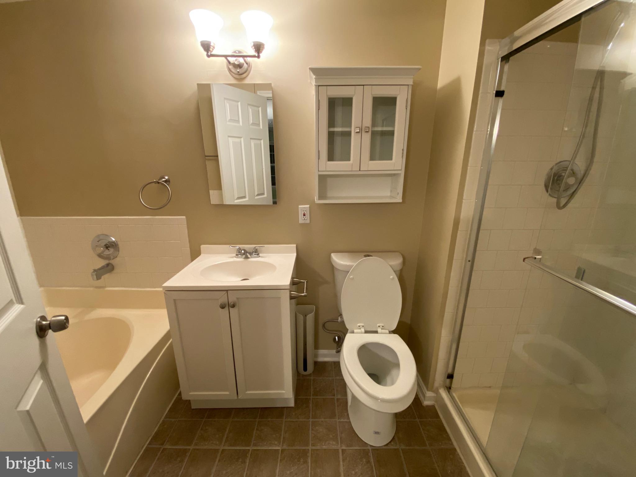 120 Langdon Farm Circle Odenton, MD 21113 - Photo 16 of 37 a bathroom with a sink toilet and shower