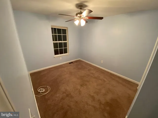 a view of a hallway with a door