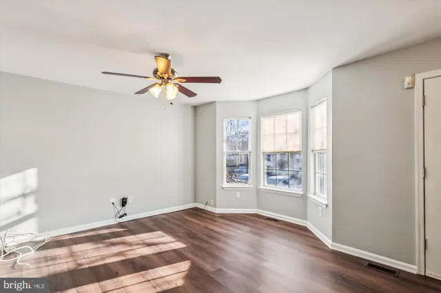 a view of a pool with sitting area