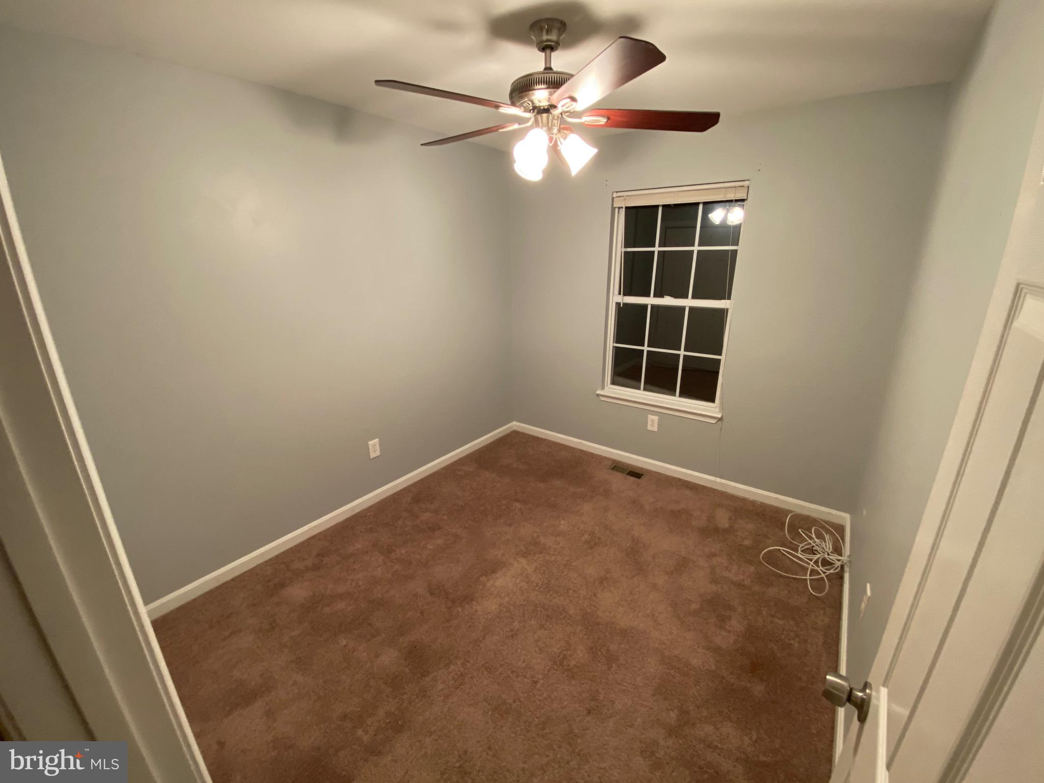 120 Langdon Farm Circle Odenton, MD 21113 - Photo 22 of 37 an empty room with windows and fan