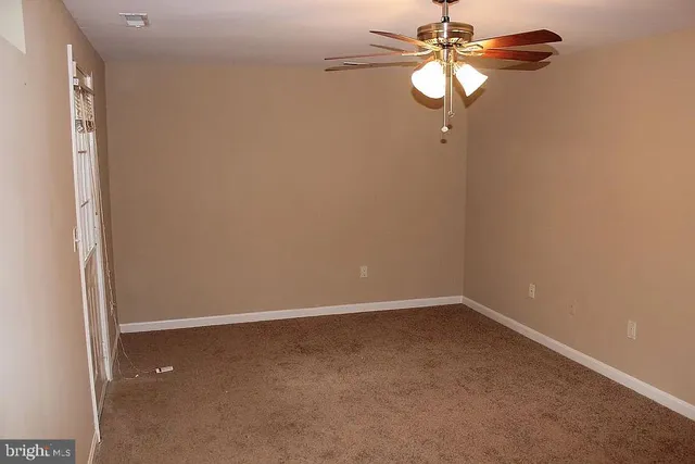 a wooden fence with trees in the background