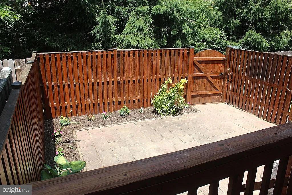 120 Langdon Farm Circle Odenton, MD 21113 - Photo 28 of 37 a wooden fence with trees in the background