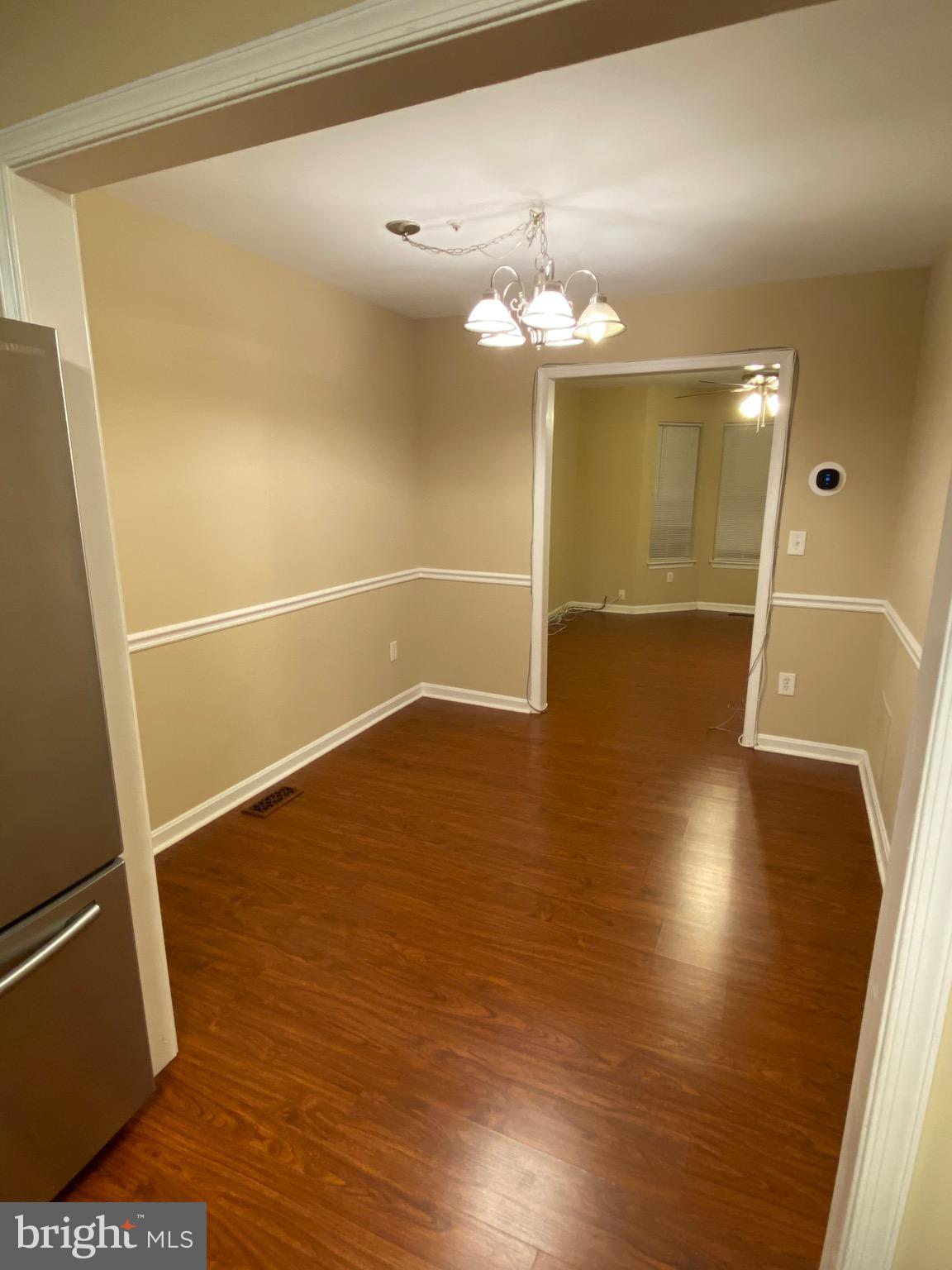 120 Langdon Farm Circle Odenton, MD 21113 - Photo 7 of 37 wooden floor in an empty room with a window