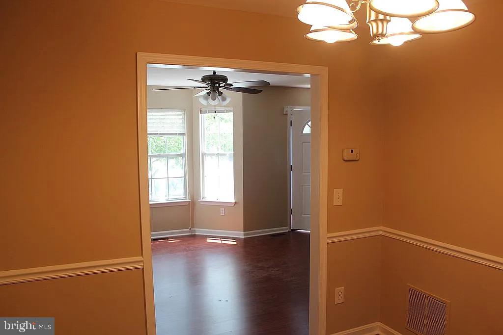 120 Langdon Farm Circle Odenton, MD 21113 - Photo 8 of 37 a view of a small space with wooden floor and a window
