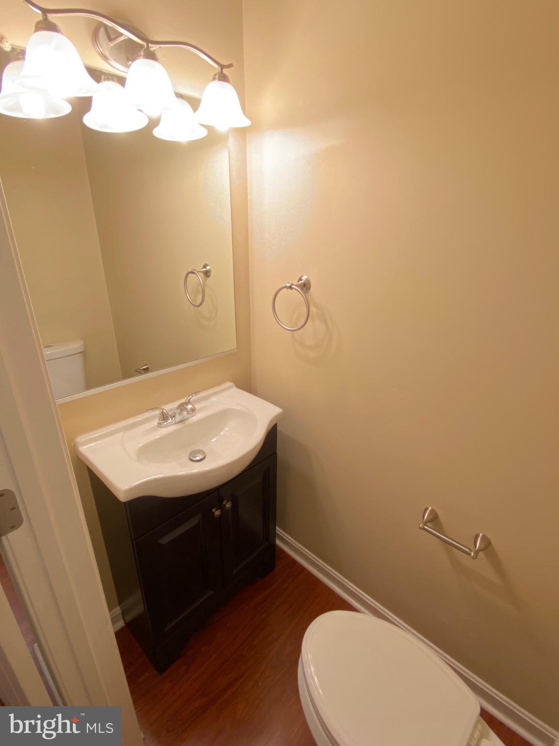 120 Langdon Farm Circle Odenton, MD 21113 - Photo 9 of 37 a bathroom with a sink a toilet and mirror