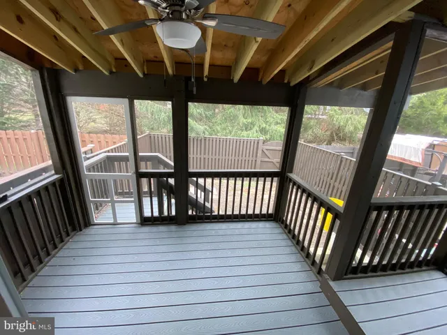 a view of a balcony with wooden floor