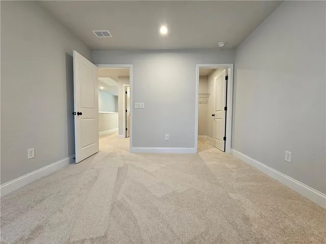 a bathroom with a double vanity sink toilet mirror and bathtub