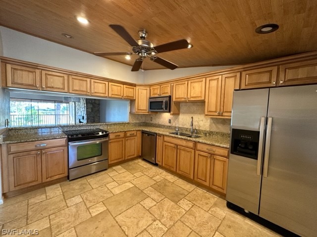 16710 Partridge Place Road, Unit 203 Fort Myers, FL 33908 - Photo 11 of 39 a kitchen with stainless steel appliances granite countertop a refrigerator and a stove top oven