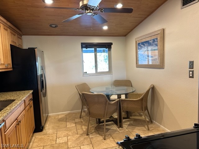 16710 Partridge Place Road, Unit 203 Fort Myers, FL 33908 - Photo 13 of 39 a view of a dining room with furniture and chandelier