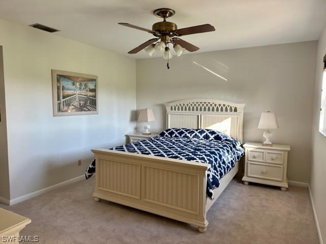 16710 Partridge Place Road, Unit 203 Fort Myers, FL 33908 - Photo 17 of 39 a bedroom with a bed and a chandelier