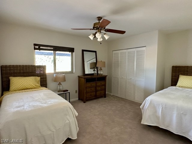 16710 Partridge Place Road, Unit 203 Fort Myers, FL 33908 - Photo 24 of 39 a bedroom with a bed and a chandelier