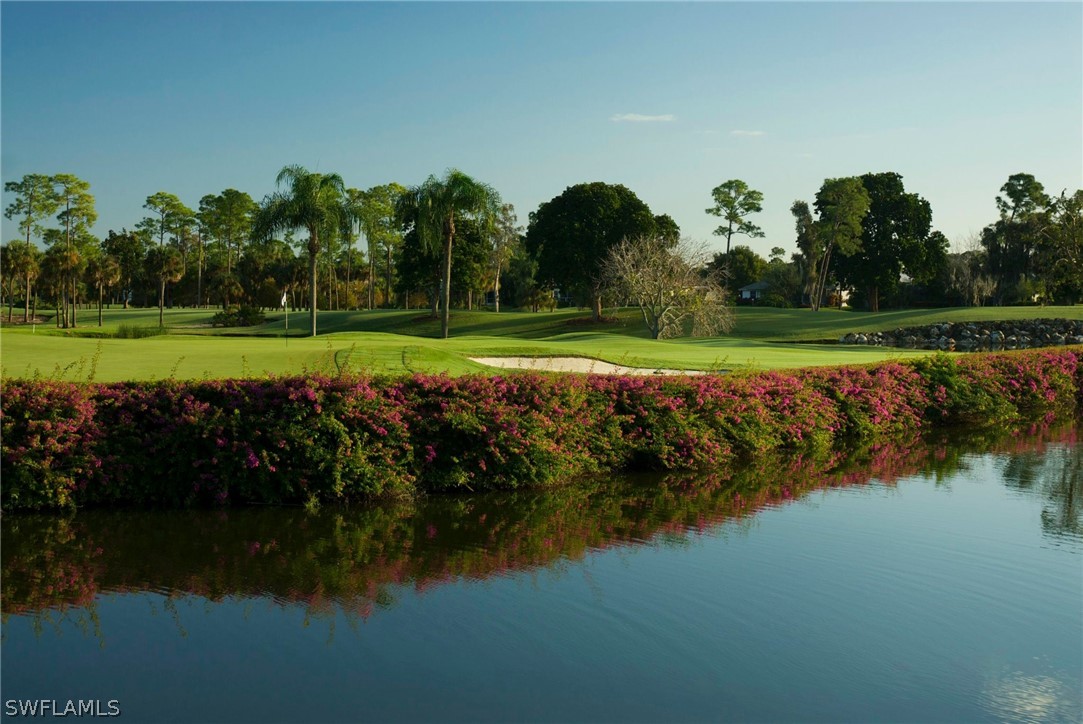 16710 Partridge Place Road, Unit 203 Fort Myers, FL 33908 - Photo 29 of 39 a view of a golf course with a lake