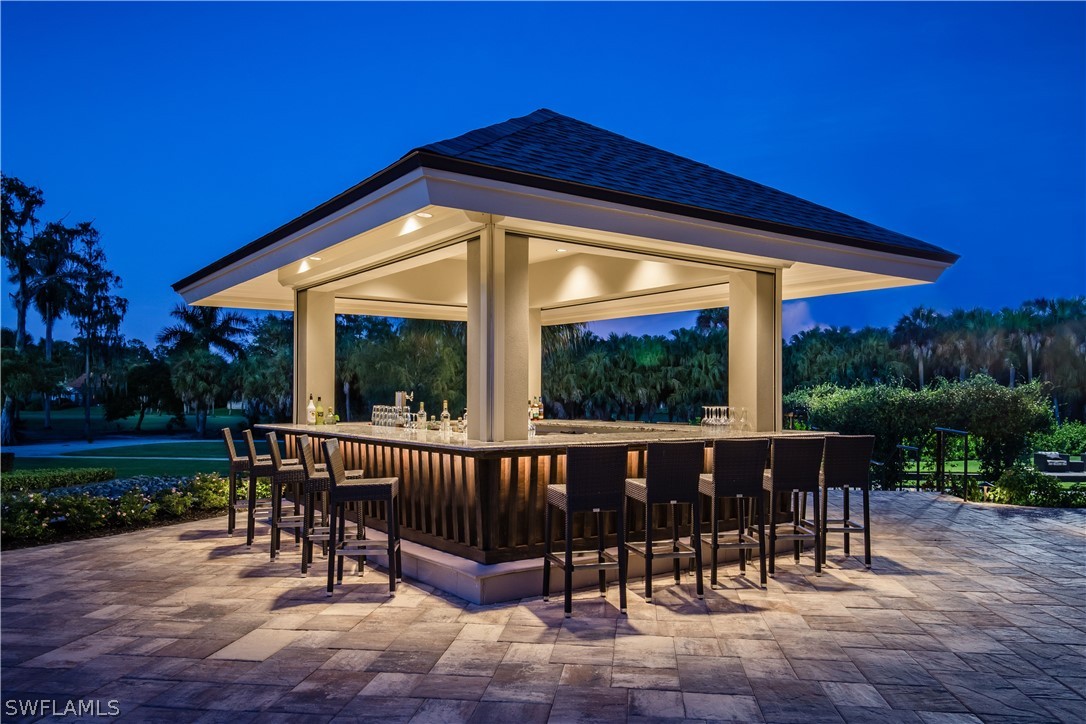 16710 Partridge Place Road, Unit 203 Fort Myers, FL 33908 - Photo 37 of 39 a view of a chair and table in the patio