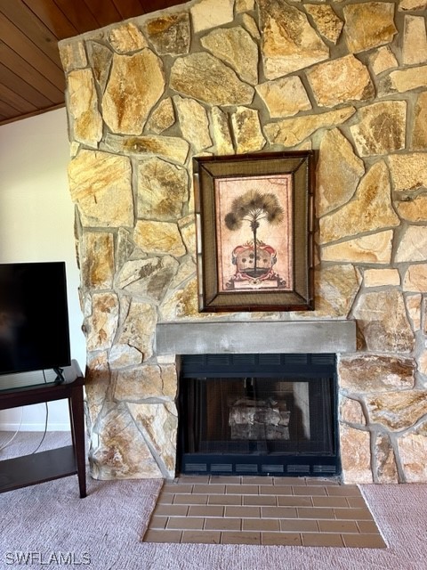 16710 Partridge Place Road, Unit 203 Fort Myers, FL 33908 - Photo 9 of 39 a living room with a fireplace and a flat screen tv