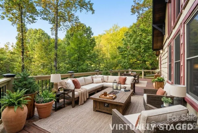 a patio with patio a couch and potted plants