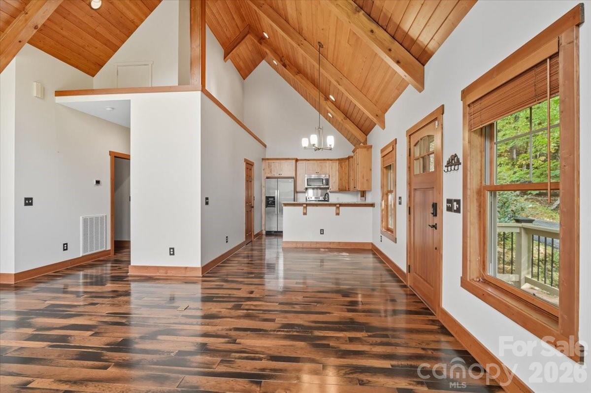 13 Miners Trace Road Burnsville, NC 28714 - Photo 14 of 34 a view of a living room with wooden floor and windows