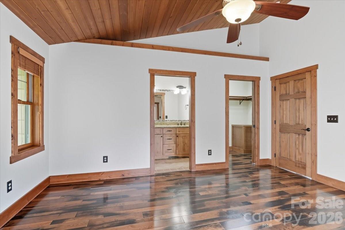 13 Miners Trace Road Burnsville, NC 28714 - Photo 17 of 34 a view of an empty room with wooden floor and a window