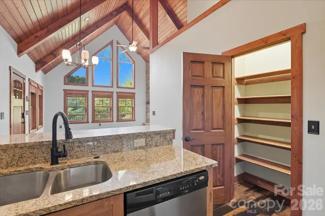 a kitchen with a sink and a refrigerator