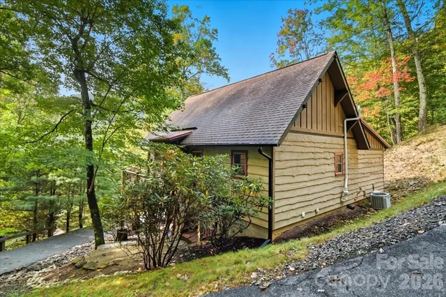 a view of a house with a tree