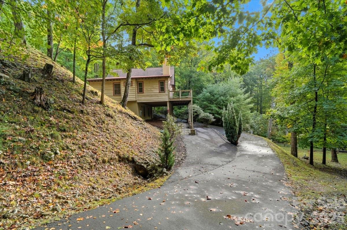 13 Miners Trace Road Burnsville, NC 28714 - Photo 6 of 34 a view of a house with a yard