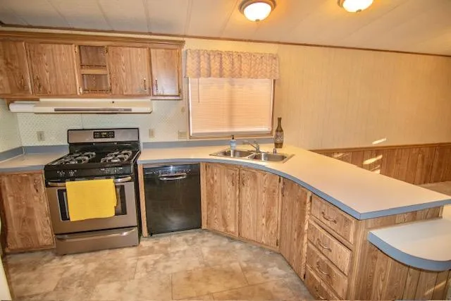 a view of a kitchen and a chandelier fan