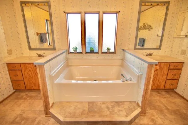 a bathroom with a bathtub and shower