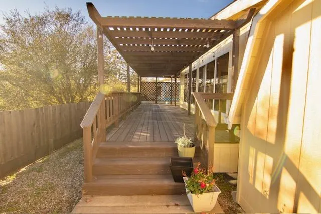 a view of a porch with wooden floor