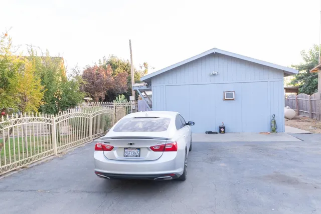 a backyard of a house with a yard and trees