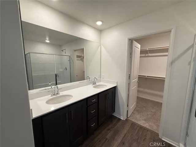 a bathroom with a double vanity sink mirror and double