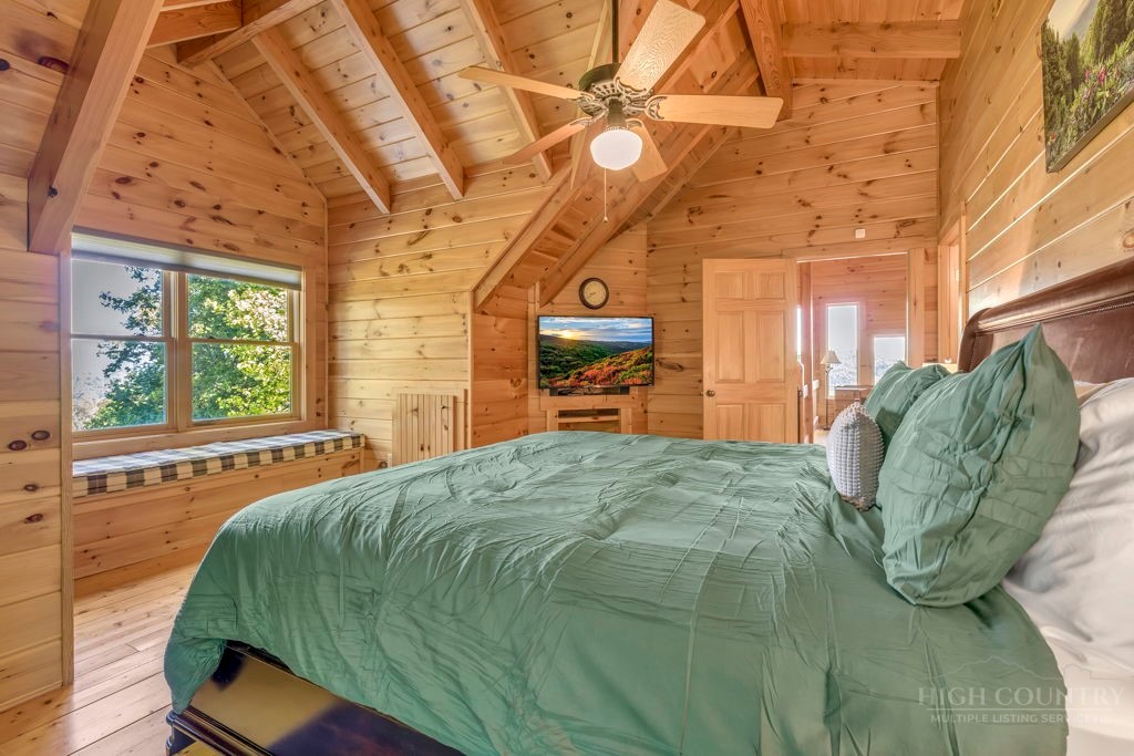 2229 Elk Ridge Road Ferguson, NC 28624 - Photo 29 of 42 a bed sitting in a bedroom next to a window