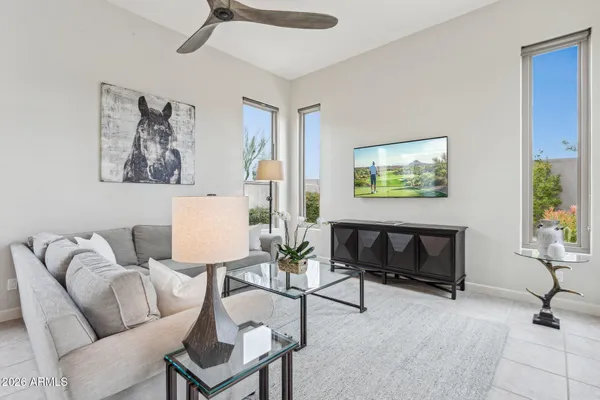 a living room with furniture and a potted plant