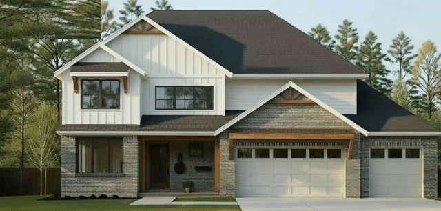 a view of a white house with large windows and a small yard